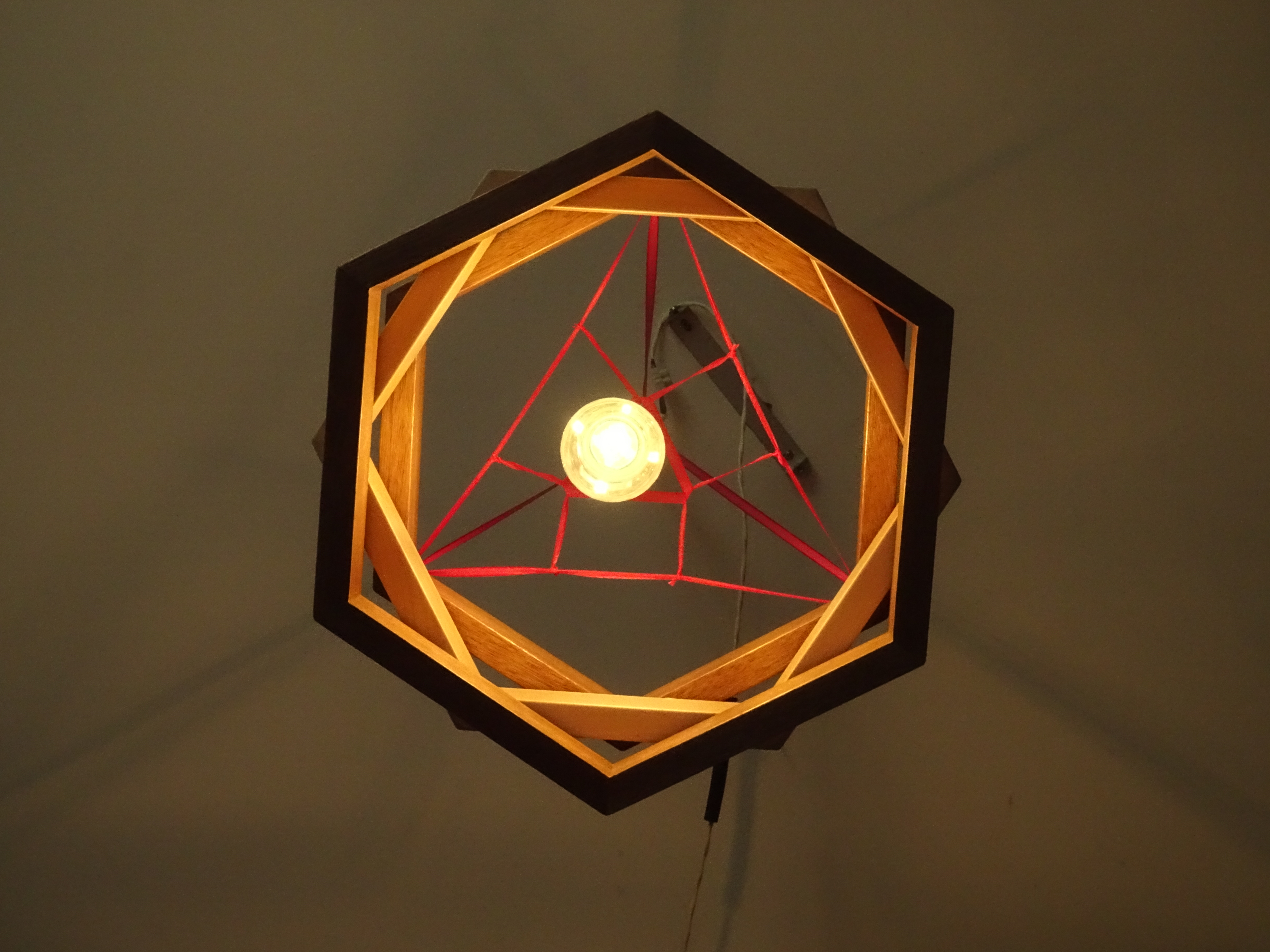 Three stacked, rotated hexagons